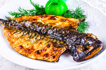 Grilled mackerel on white plate