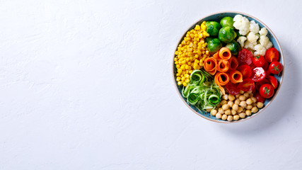  Buddha Bowl Vegetarian on a white Background. Raw Vegetables and  in chickpeas  a one bowl.Food or...