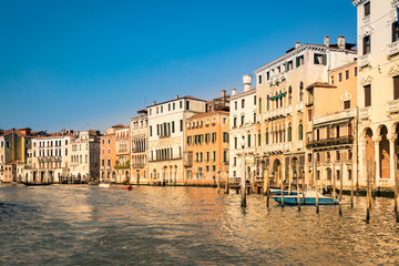 Fototapeta na wymiar Historic buildings on the banks of the grand canal in Venice.