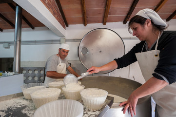 Shepherds prepare ricotta cheese with fresh sheep's milk