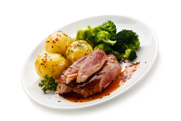 Grilled beefsteak with broccoli and carrot on white background 