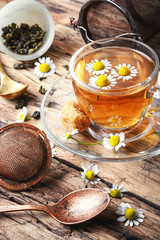 Herbal tea with fresh chamomile flowers