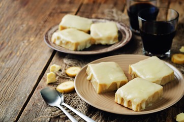 White chocolate banana bars on a dark wood background