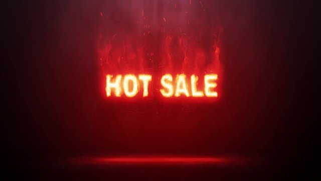 Hot sale sign burning with a bright flame on a dark background