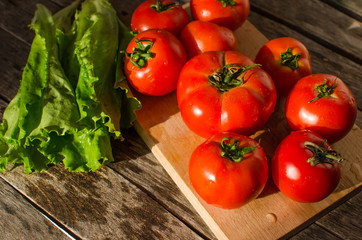 Ripe tomatoes on a cutting Board