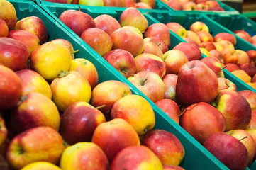 Apples on boxes in supermarket