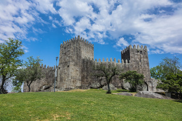 Fototapeta na wymiar Castle of Guimaraes - medieval castle in the municipality Guimaraes, in the northern region of Portugal. It was built under the orders of Mumadona Dias in the 10th century.