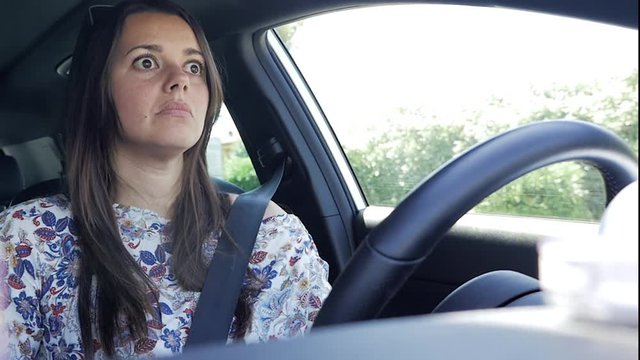 Woman driving car very tired