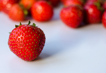 Summerwarm strawberries on white background