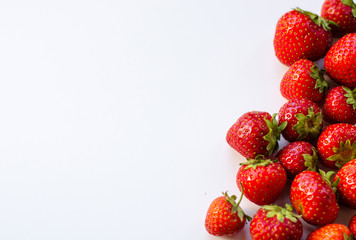 Summerwarm strawberries on white background