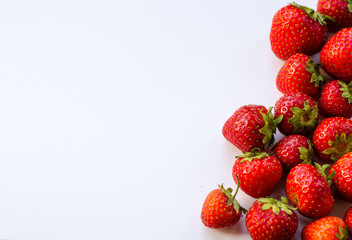 Summerwarm strawberries on white background