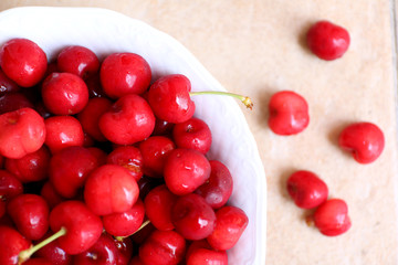 Healthy, juicy, fresh, organic cherries in fruit bowl close up. Cherries in background.
