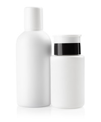Set of two white bottles for cosmetic liquids, isolated on white