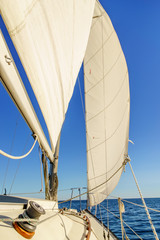 Sailboat with sail and clear blue sky, Toronto, Ontario, Canada.