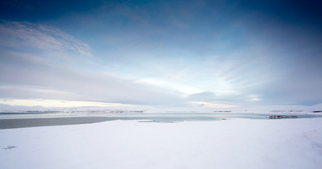 Horizontal, panoramic snow covered landscape scenic at day, Iceland, Europe.
