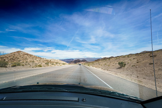 Open road in desert as seen through car windscreen, Las Vegas, Nevada, USA. colour picture from nevada usa 2017