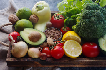Organic vegetables,fruit, herbs,nuts,seeds in wooden box for healthy lifestyle, raw vegan diet, selective focus