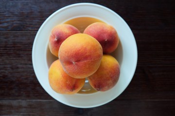 Plate with fresh juicy peaches 
