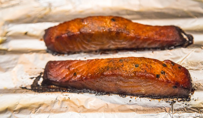 Oven Baked Bourbon Glazed Salmon: Oven baked bourbon glazed salmon on a sheet of aluminum foil.