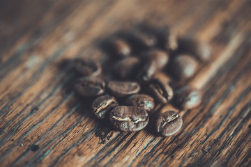 Top view of coffee beans on wood background, Colour retro style, Thailand