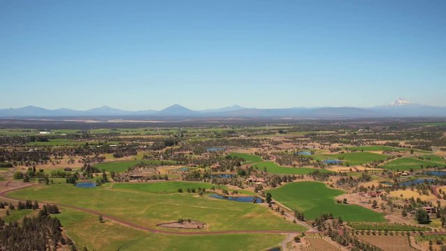Oregon Aerial v6 Flying low over Smith Rocks with panoramic mountain views