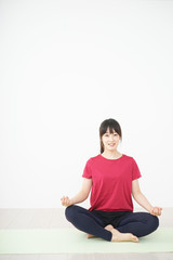 Fototapeta premium Young woman doing yoga