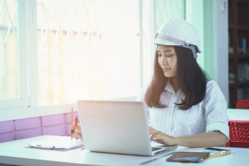 Engineering women working Engineering workplace - Engineering project, blueprints, ruler, calculator, laptop and divider compass. Construction concept. Engineering .selective focus