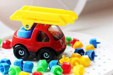 Fototapeta premium Children's multicolored mosaic and toy car