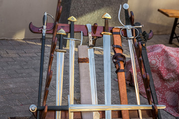 Knight items during medieval carnival in Riga Old Town During sunset time.