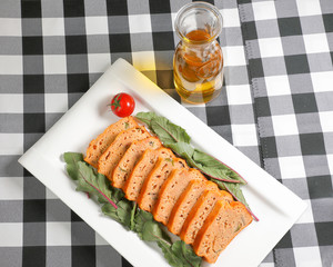 Meatloaf slice red chard leaf .