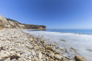 Rocky coast with blurred water motion at Abalone Cove Shoreline Park in Ranch Palos Verdes, California.