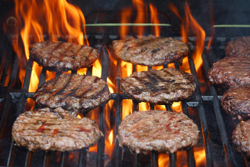 barbecue grill cooking burger steak on the fire