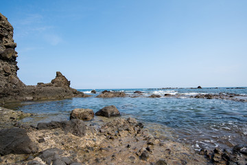 Fototapeta na wymiar sea beach coast ocean sand rock vacation sky water island view travel