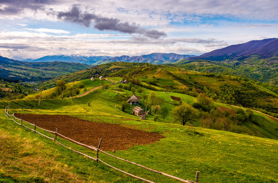 wooden fence on the hillside in Carpathian rural area