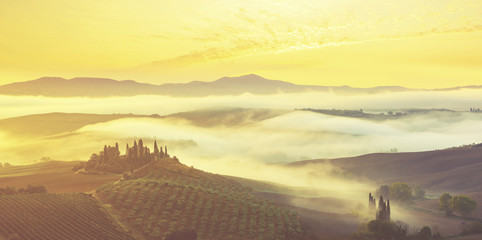Naklejka na ściany i meble Pienza, Italy-September 2015: autumn panorama of the most beautiful area in Tuscany, Val d'Orcia Valley.Vintage color tone