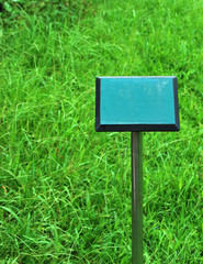  Explanatory sign on grass field in a garden