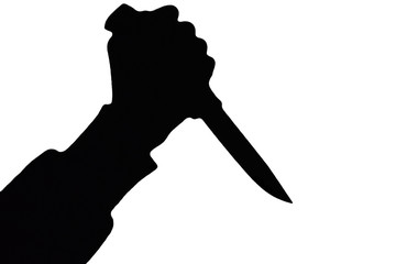 Isolated human hand with killing knife silhouette (shadow) on white background. Graphic resources for designers and criminal news and chronicles.