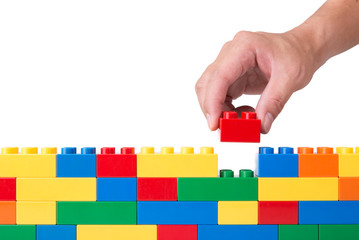  hand building up a block