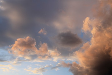 Fototapeta premium Blue sky with dynamic colorful clouds after rain