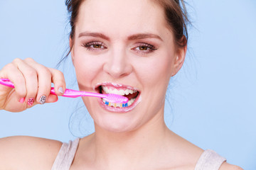 Woman brushing cleaning teeth