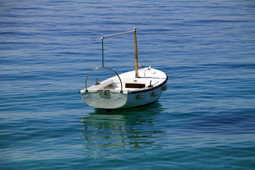 Small white boat in Adriatic sea , Croatia