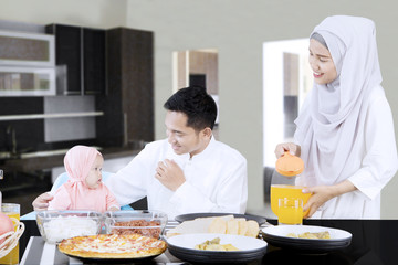 Family eating together in dining room