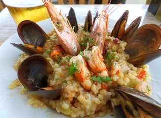 Greek style seafood Trachanotto (Frumenty) with mussels and shrimps, Mykonos island, Greece