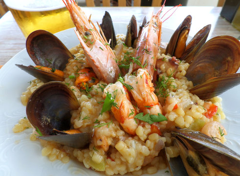 Greek style seafood Trachanotto (Frumenty) with mussels and shrimps, Mykonos island, Greece