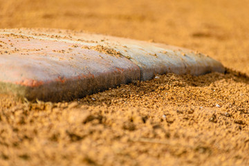 Close-up of base on a baseball field