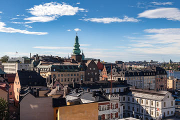 Fototapeta premium STOCKHOLM, SWEDEN - SEPTEMBER, 16, 2016: Cityscape image during daytime with sun light. Old town panoramic view.