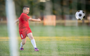 Kids soccer football - children players match on soccer field