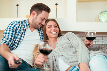  Young couple drinking red wine and smiling
