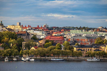 Fototapeta na wymiar STOCKHOLM, SWEDEN - SEPTEMBER 16, 2016: Aerial view of central part of city with embankment and boats.