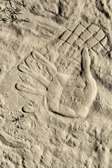 Fototapeta na wymiar Hand sand imprint